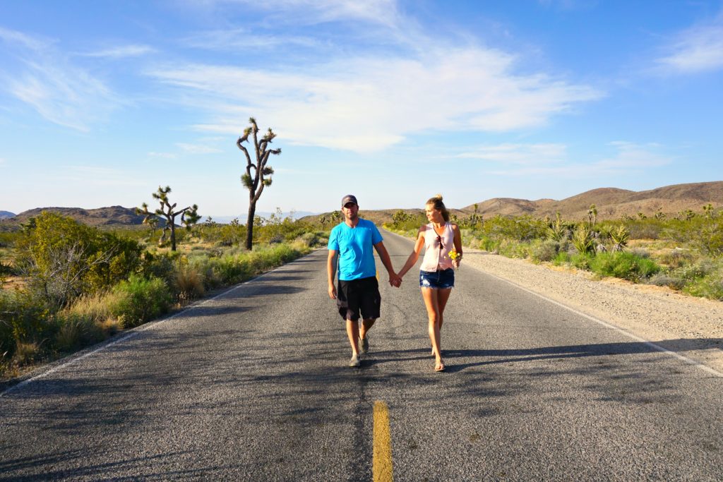 couple walking down street in Joshua Tree National Park California