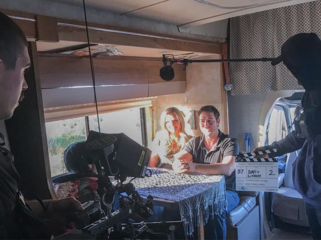 Couple being filmed in RV with camera crew