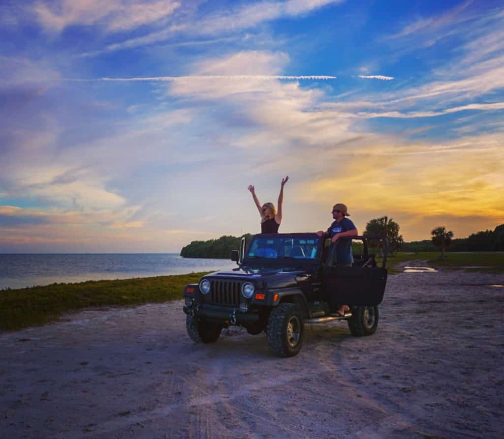 Jeep on the beach at sunset in Florida