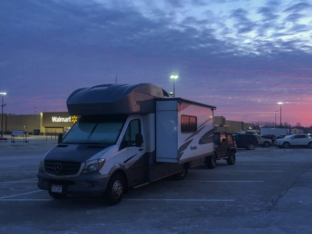 RV parked at a walmart with beautiful sunrise