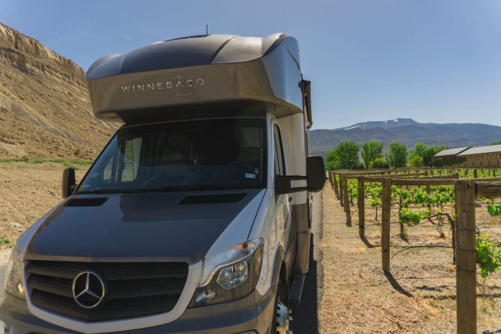 RV parked next to vineyard