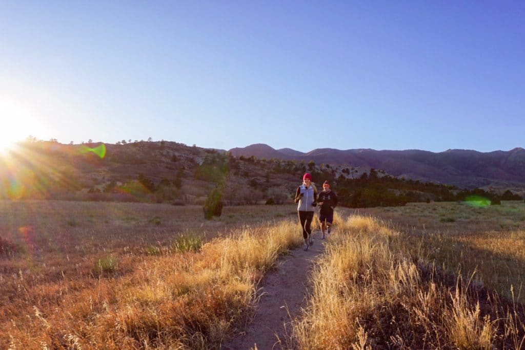 couple running along trail