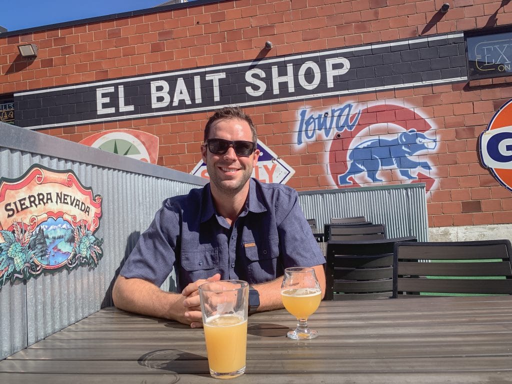 Man drinking a beer at el bait shop in des moines iowa