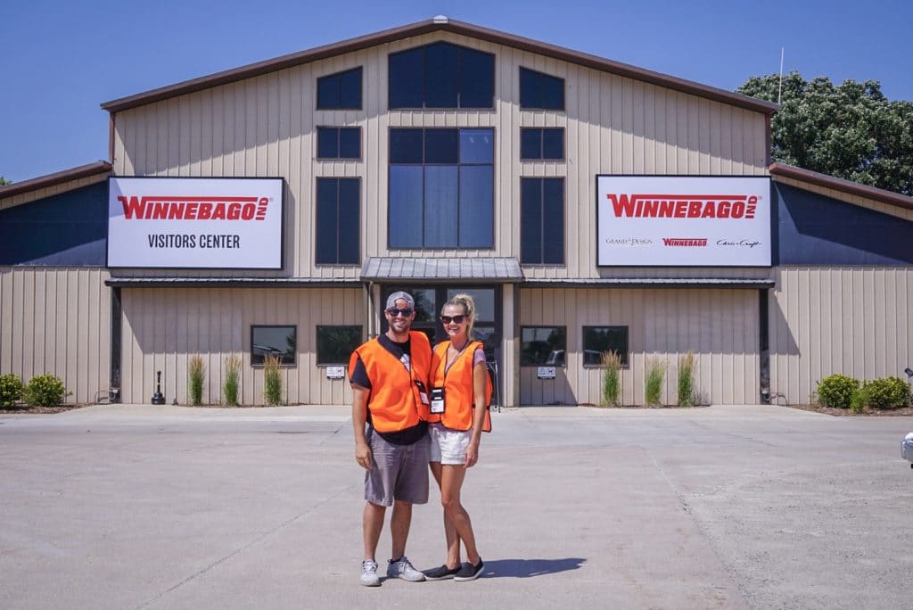 Couple standing in front of Winnebago Factory