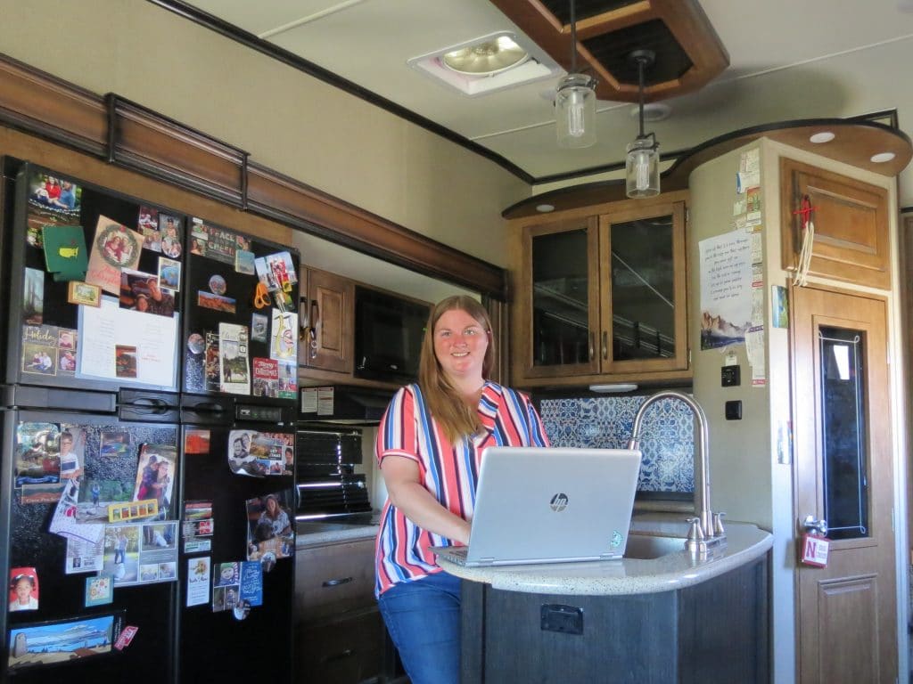 Woman working remote from RV fifth wheel 