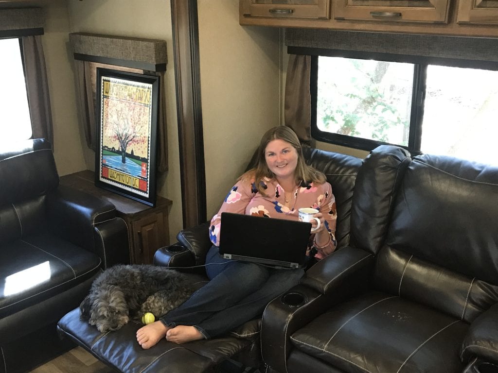 Woman working remote from RV fifth wheel 