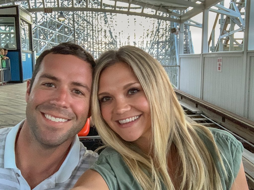 Couple on a roller coaster about to take off