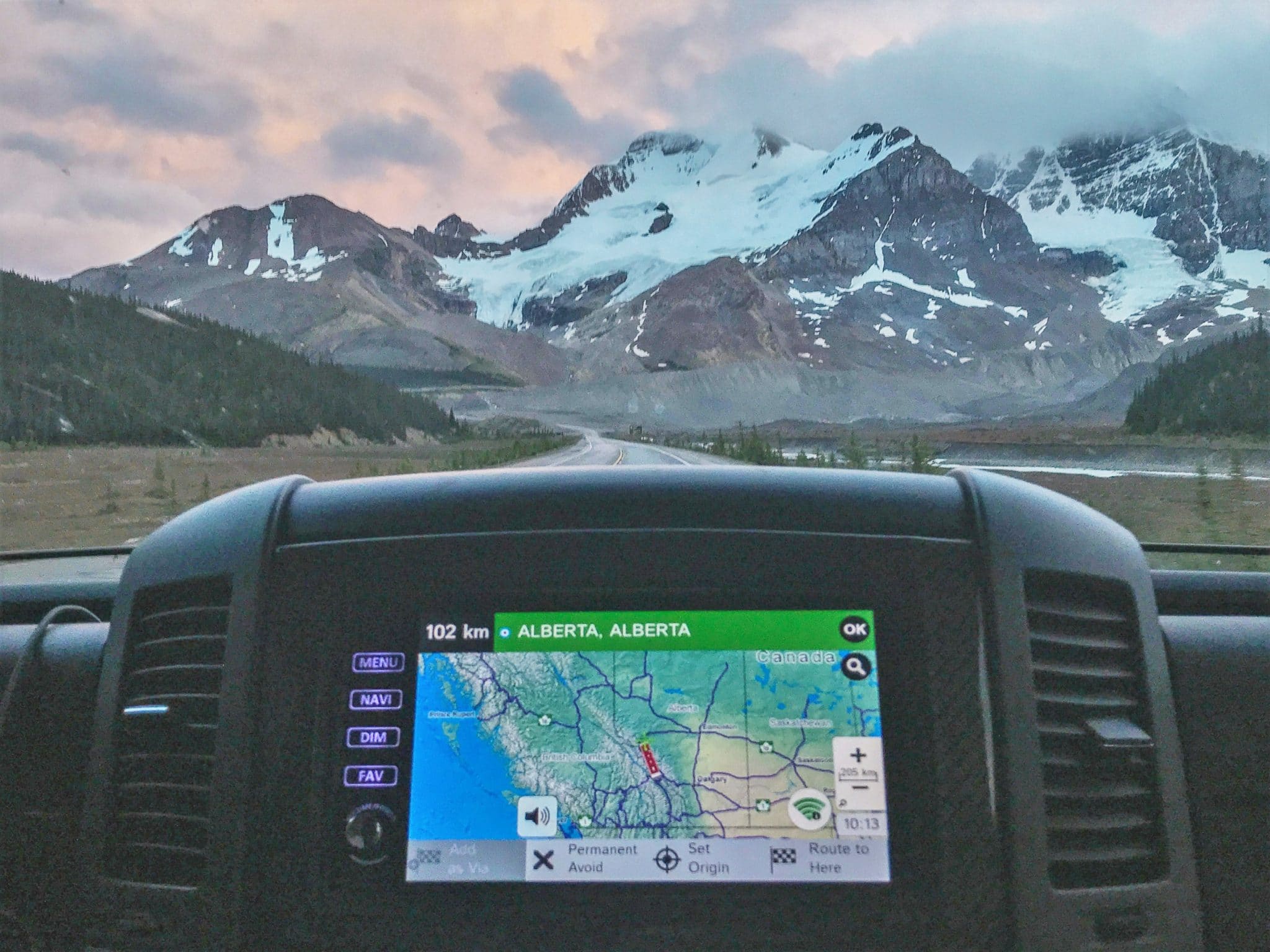 Dashboard of an RV with navigation on showing map of Alberta Canada on a glacier view road