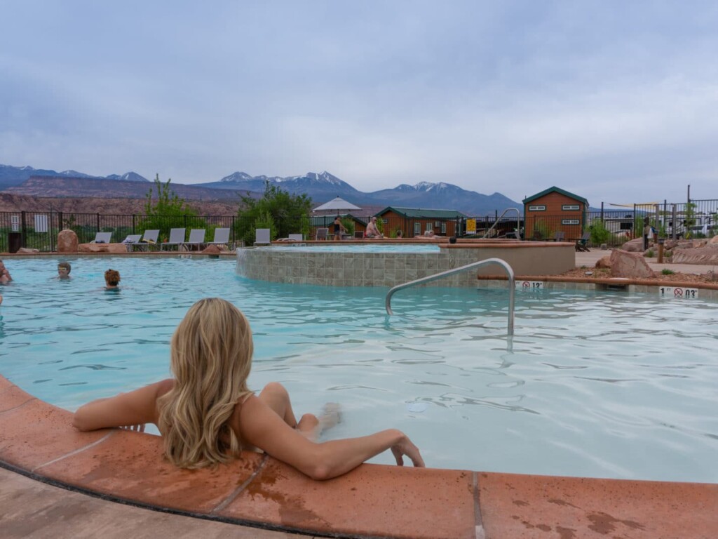 Just couldn't get enough of the pool! Woman in pool looking at views in moab at KOA campground